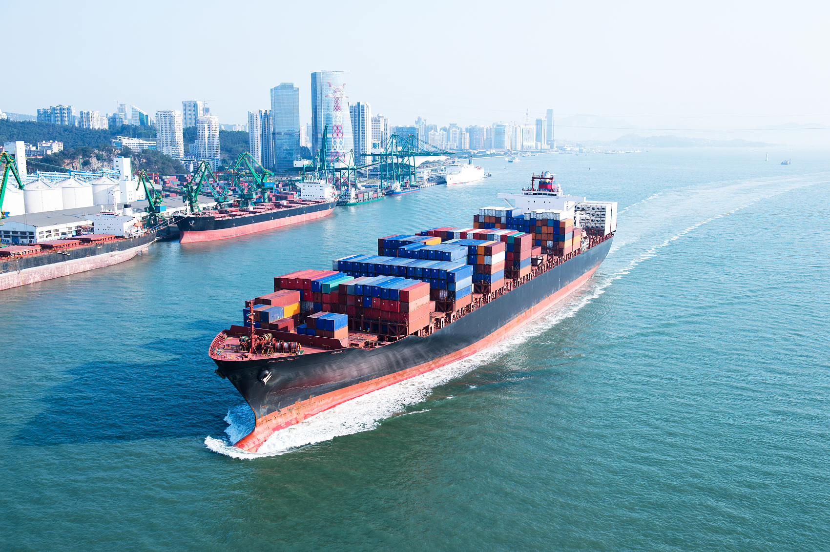 Customs officer inspecting air freight documentation for Canada import